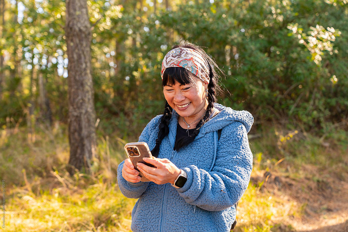 Woman operating cell phone