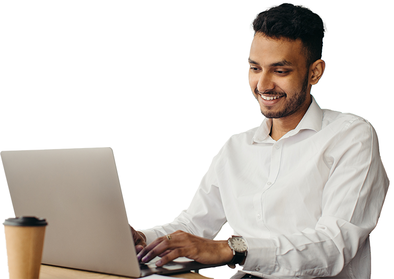 Man smiling while at laptop computer