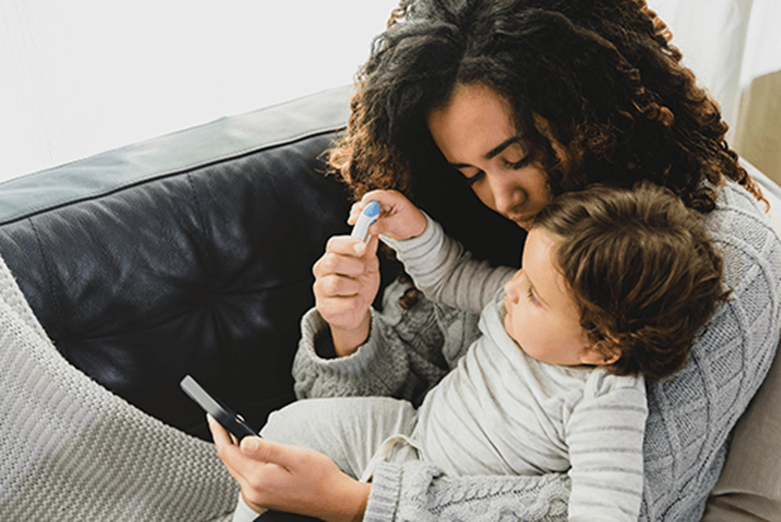 mother and baby looking at phone