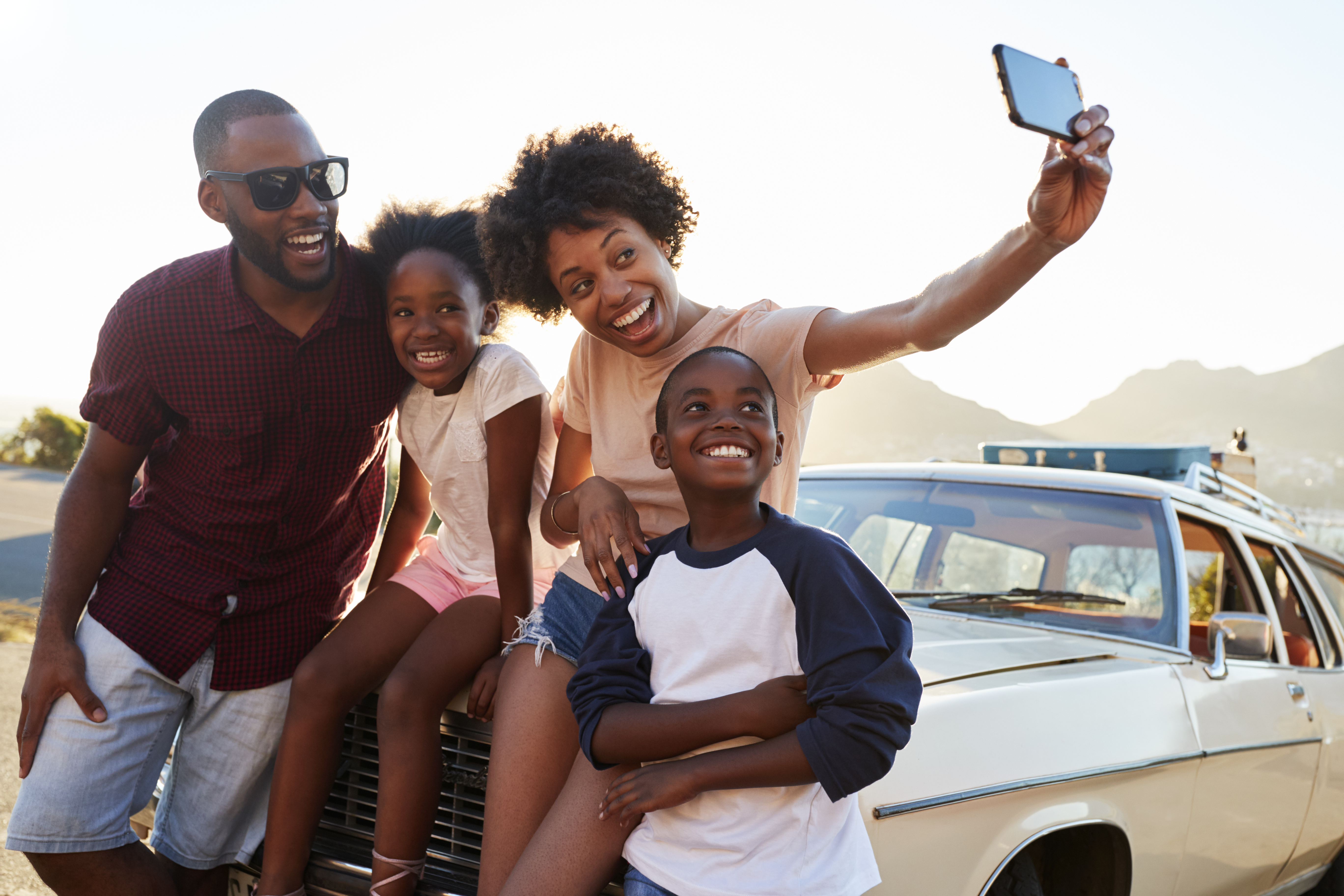 family-of-four-taking-selfie family of four taking selfie